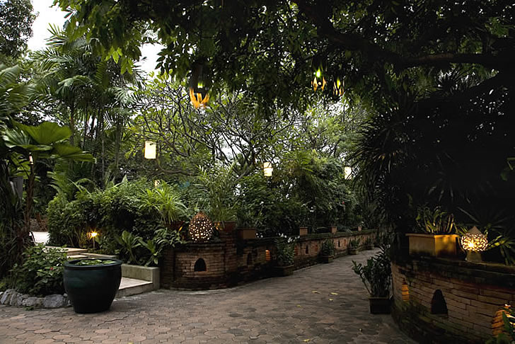 Chakrabongse Villas, Bangkok, Thailand - gardens with lanterns lit Chakrabongse Villas, Bangkok, Thailand - gardens with lanterns lit